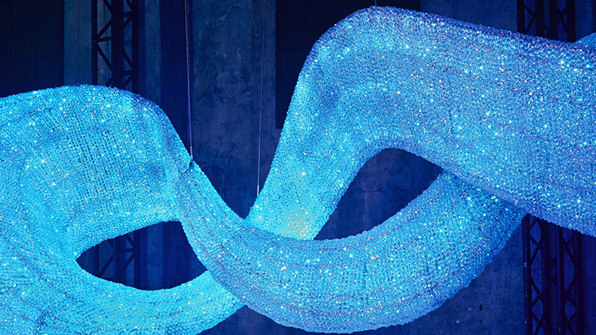 Wavy blue light installation coiled around itself