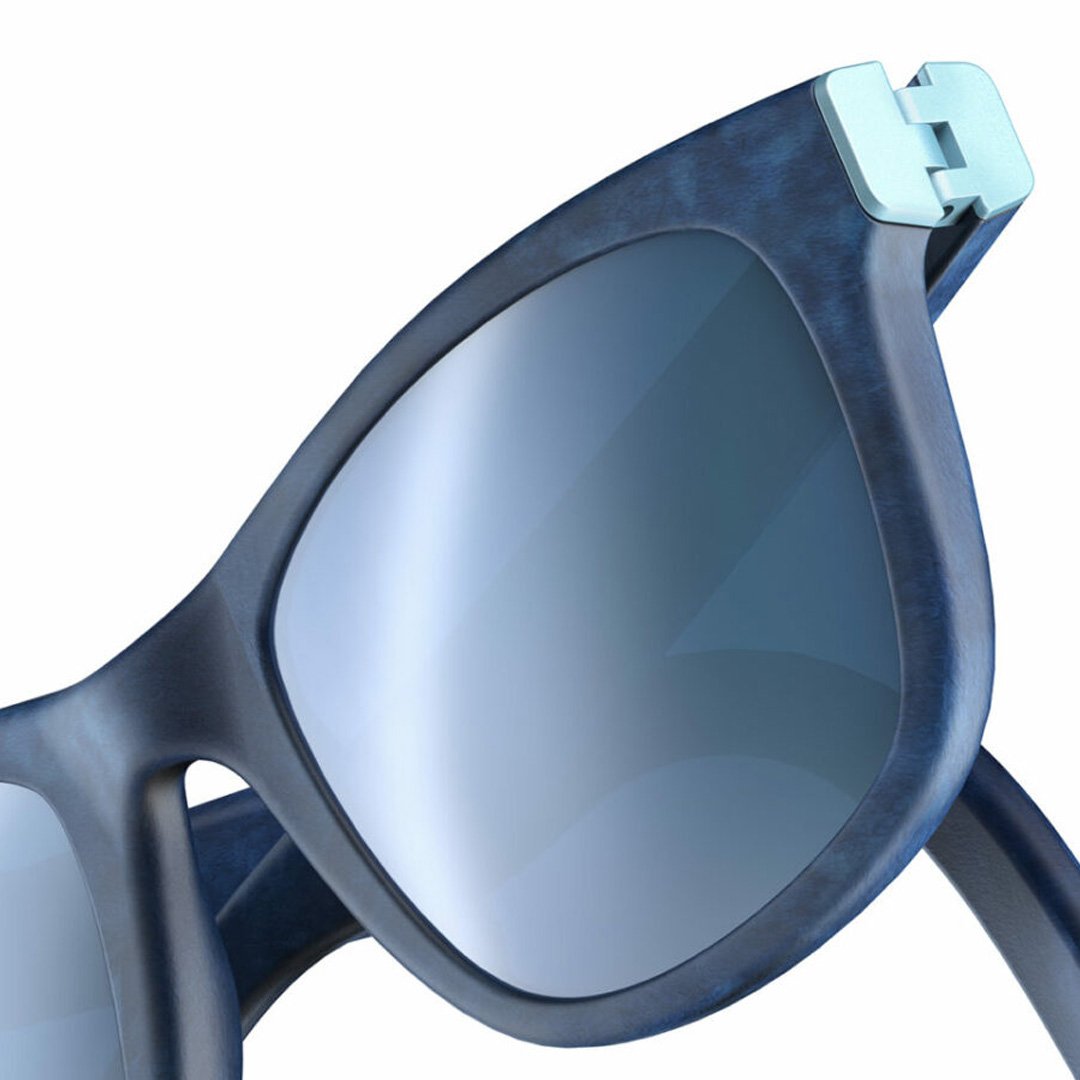 Blue-framed sunglasses with dark lenses on a white background