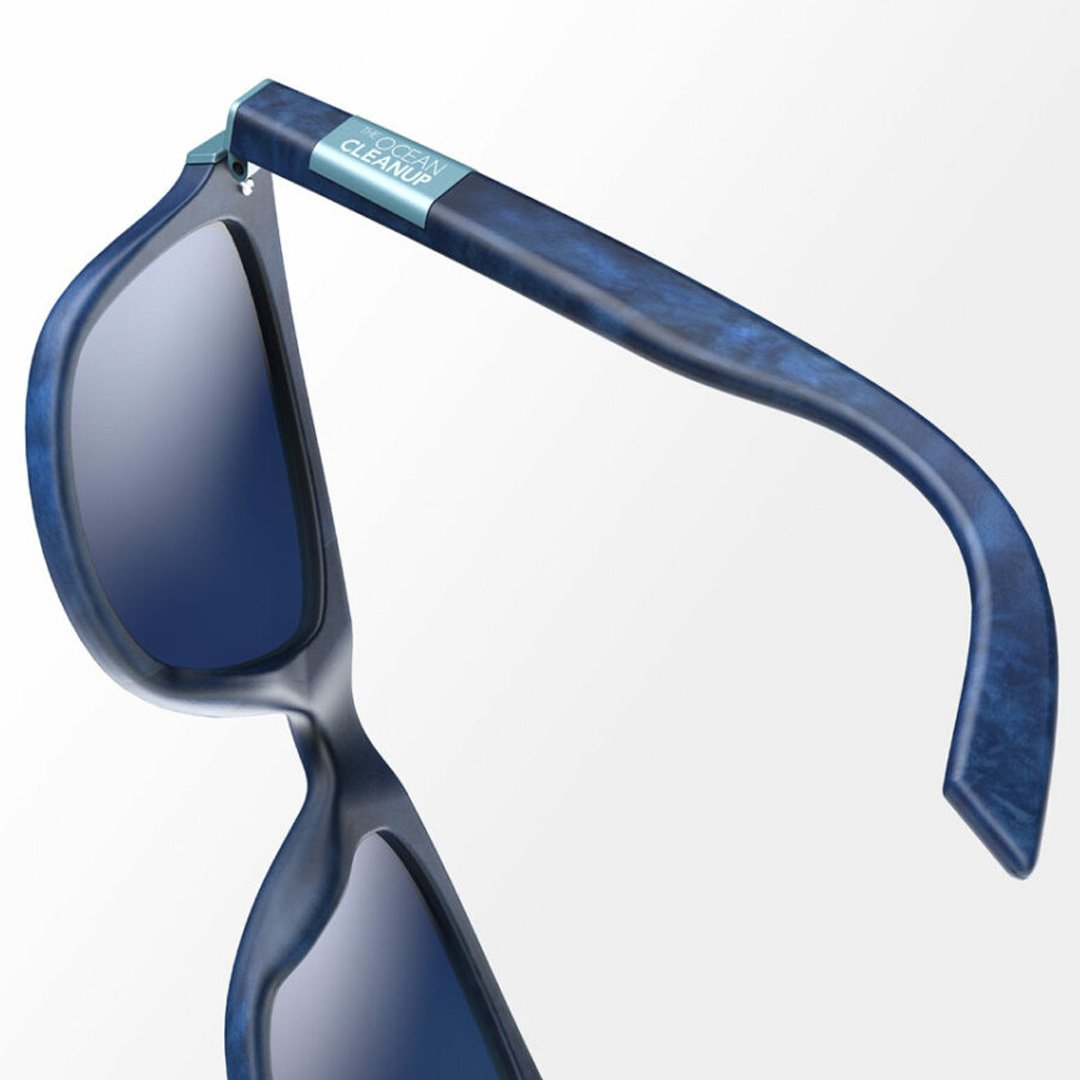 Blue sunglasses with curved frame and dark lens on a white background