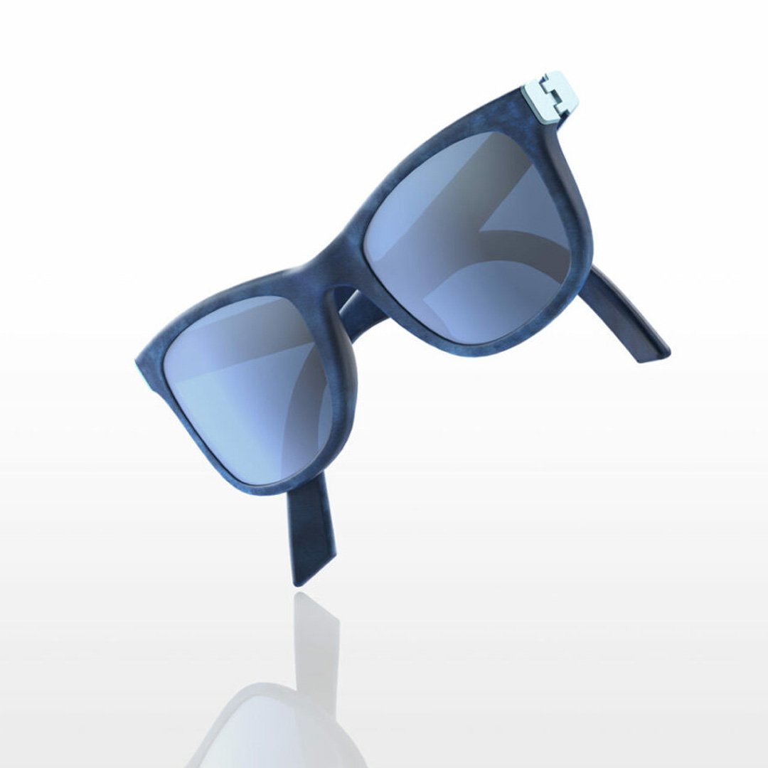 Blue sunglasses on a surface with dark lenses