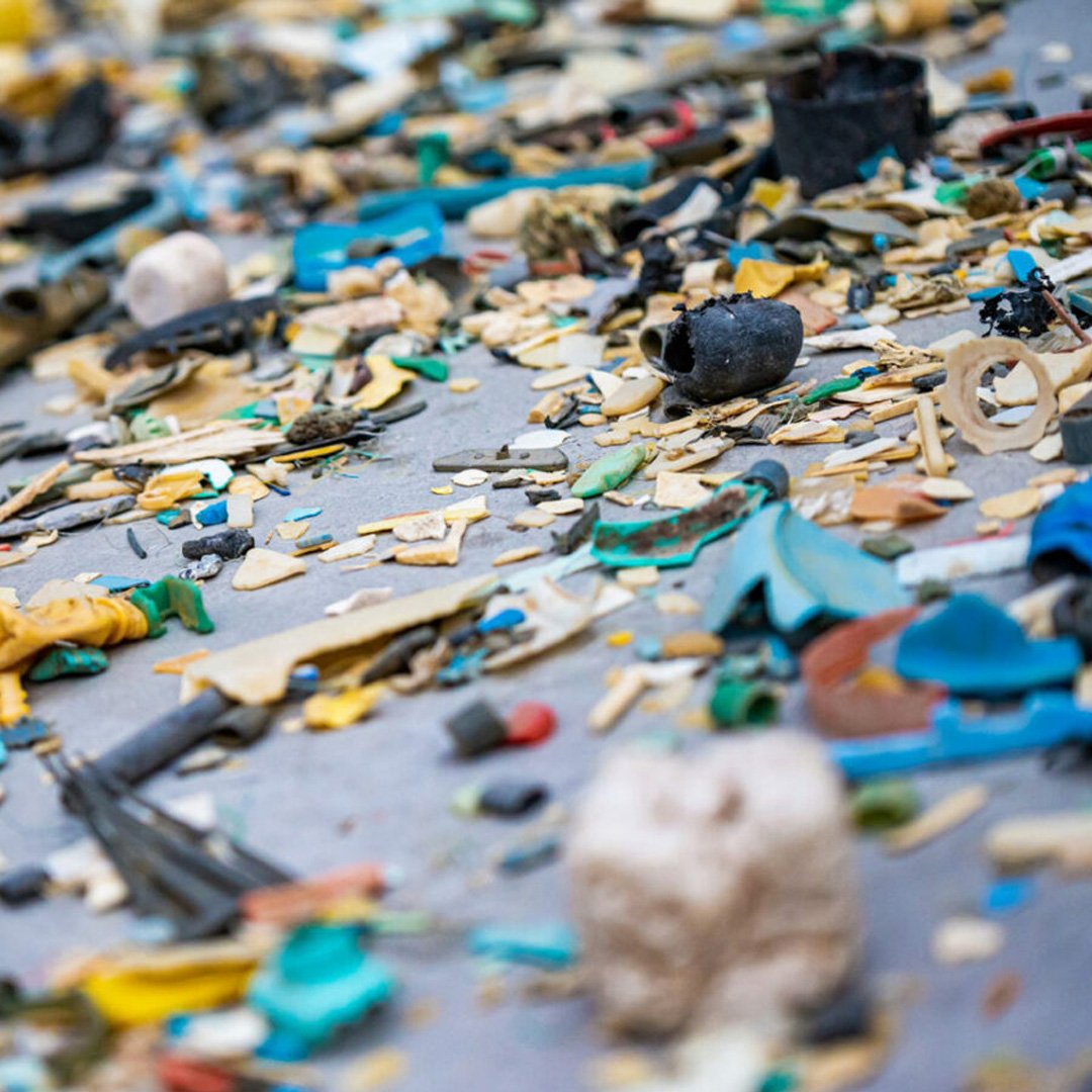 Blue, green, and yellow plastic pieces scattered on a surface