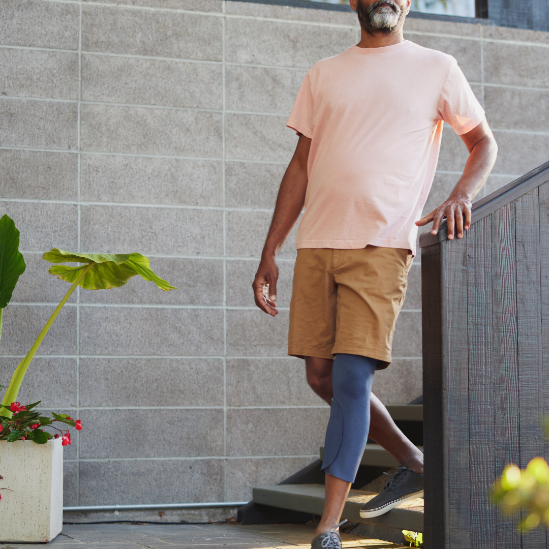 Man wearing CIONIC bionic leg garment