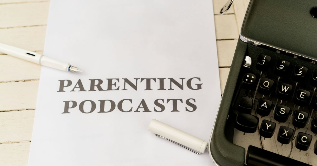 a paper with the words parenting and a pen next to it