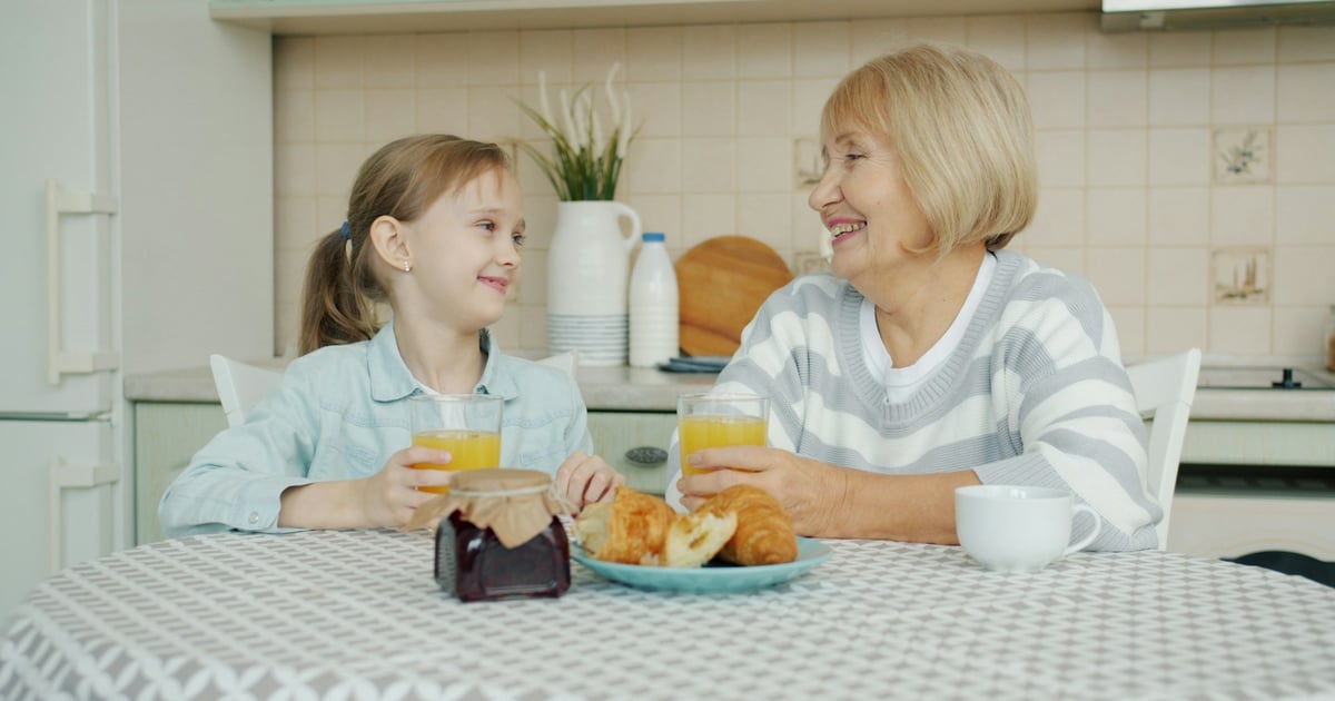 Grandmother and granddaughter enjoying breakfast together.