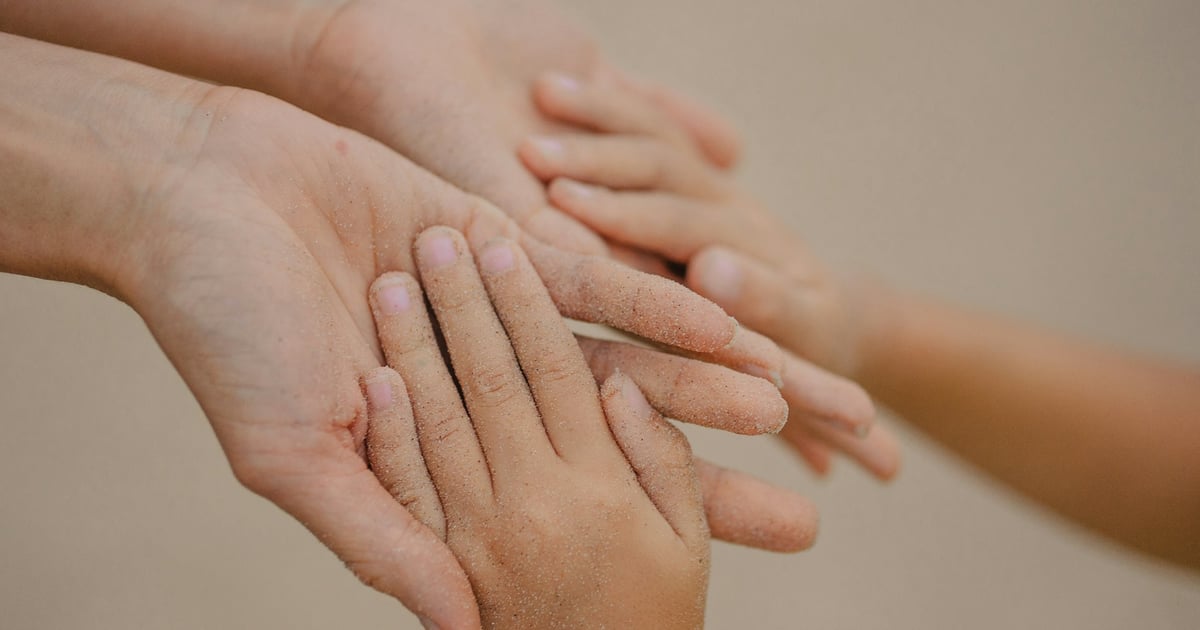 Multiple hands of different sizes layered together