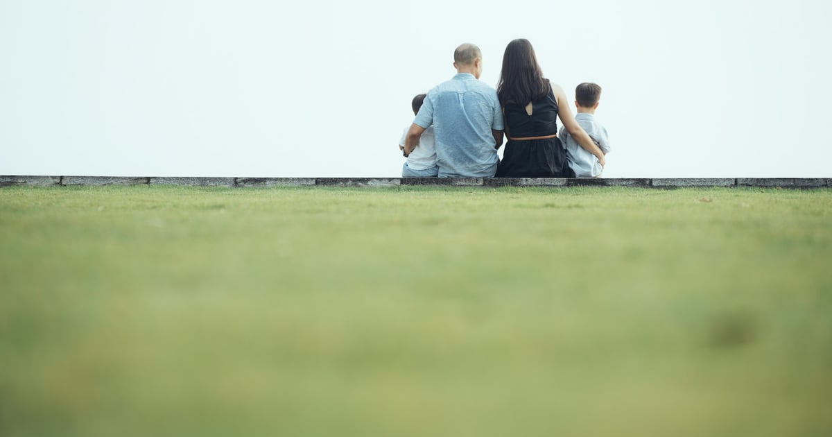 Family sitting together looking out at the view