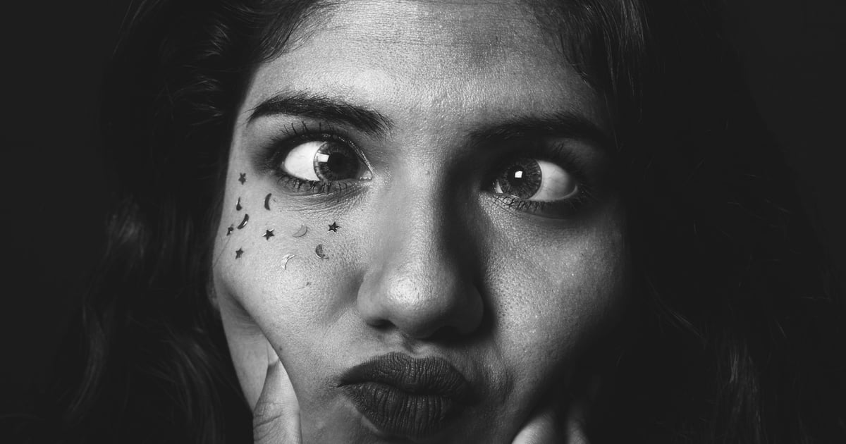 grayscale photo of womans face