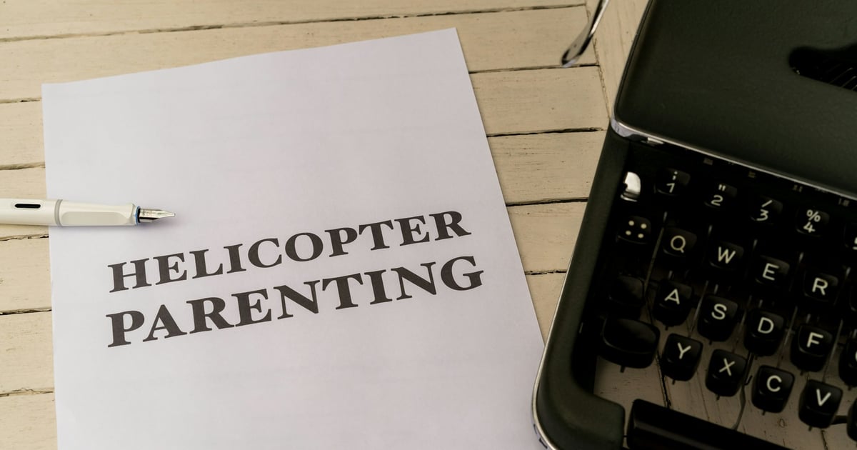 a close up of a paper with the words helicopterer parenting on it