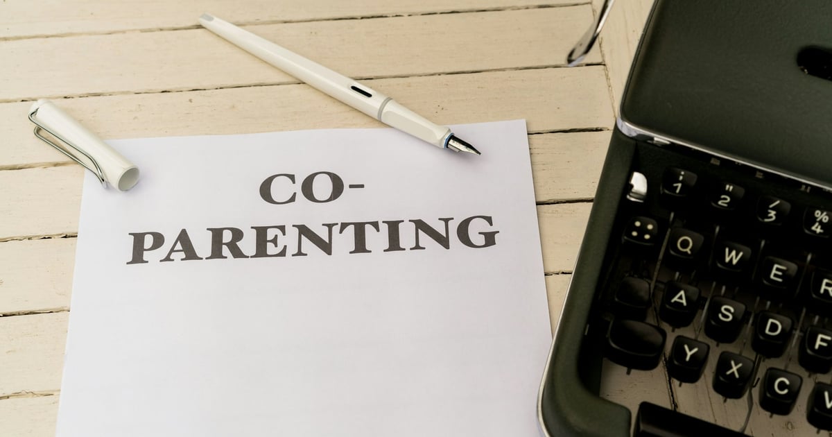 a piece of paper with the words co - parenting on it next to a