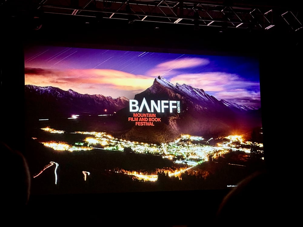 Title screen for the Banff Centre Mountain Film and Book Festival, projected on the screen in the Riverwalk Center in Breckenridge, CO