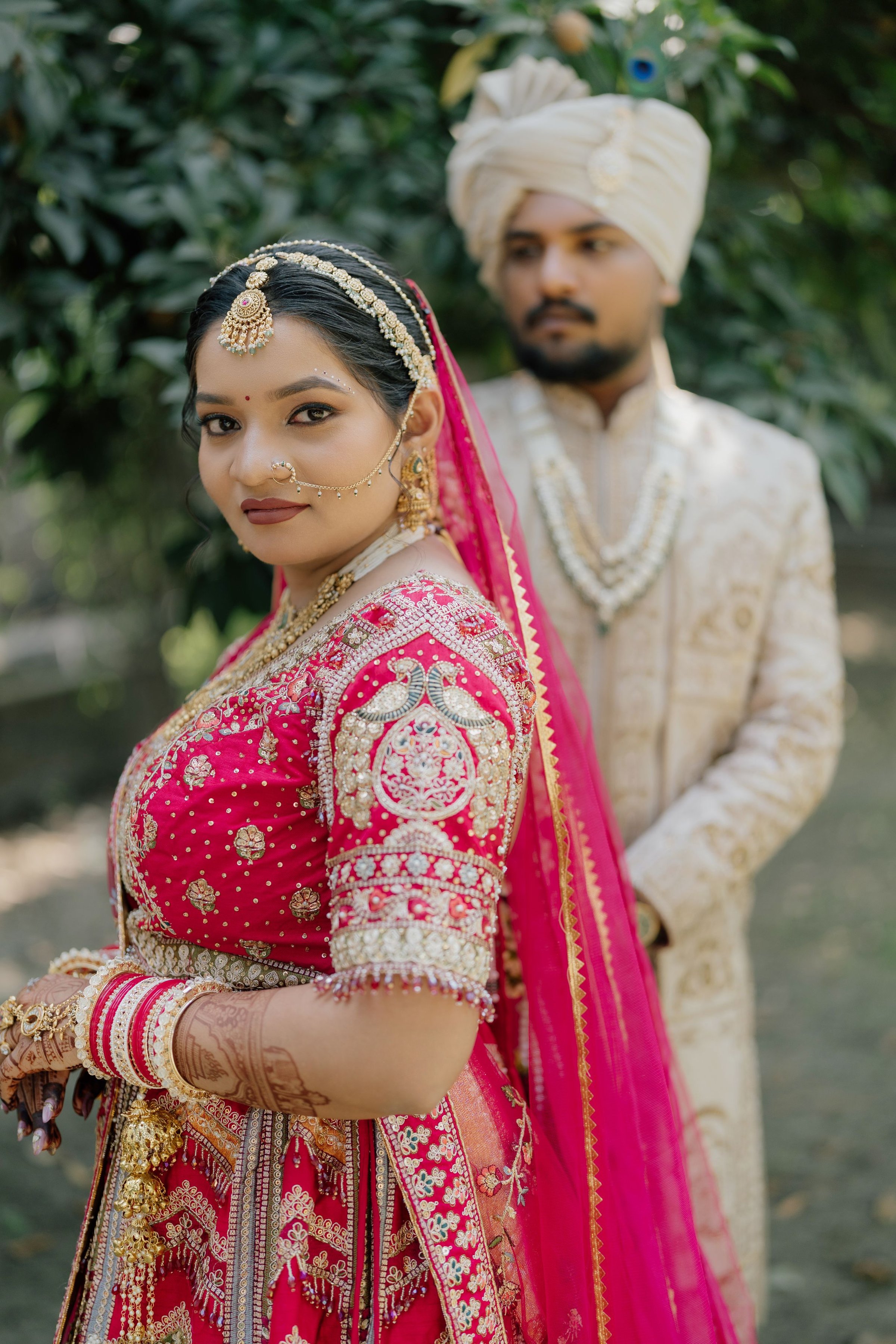 The newly engaged, in pink and gold