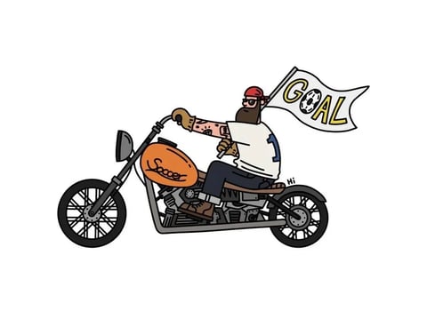 This image is a stylized, illustrative cartoon with a flat, 2D aesthetic and bold, clean line art. The color palette is vibrant and saturated, featuring a dominant orange on the motorcycle's fuel tank, paired with a white jersey, dark pants, and a red cap, all set against a plain white background for high contrast. The lighting is flat and uniform, with no visible directional light source or shadows, creating a simple, graphic look. Textures are minimal and implied through flat color fills and line work, giving a smooth, non-tactile feel. The composition is a centered, side-profile view of the motorcycle and rider, with a clear, uncluttered spatial arrangement that emphasizes the subject. Shape language is a mix of organic forms for the character and geometric lines for the motorcycle, with consistent, medium-weight outlines and sharp edges. The mood is playful and energetic, conveying a lighthearted, cartoonish atmosphere with a focus on clear, graphic storytelling.