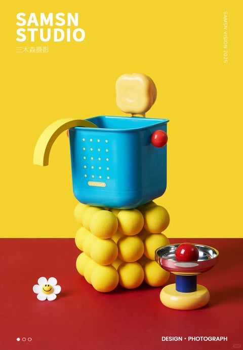 This image presents a highly stylized, 3D-rendered still life composition with a distinct pop-art and Memphis design influence, characterized by a playful, toy-like aesthetic. The visual style is clean and crisp, utilizing a photorealistic rendering technique that emphasizes smooth, glossy surfaces and precise geometric forms, yet maintains an illustrative quality through its simplified shapes and bold color blocking. The dominant color language is vibrant and highly saturated, featuring a primary palette of bright lemon yellow, electric cyan blue, and a deep, matte red, creating strong chromatic contrast and high visual energy. Lighting is directional and relatively hard, casting defined, soft-edged shadows that enhance the three-dimensionality of the objects without creating harsh drama, suggesting a bright, studio-lit environment. Textures are rendered with a focus on tactile, synthetic materials: the blue container has a smooth, semi-gloss plastic finish with subtle highlights, the yellow spherical base appears soft and slightly porous like foam or rubber, and the metallic bowl exhibits a polished, reflective chrome surface. The composition is centrally framed and vertically stacked, creating a totem-like structure with clear spatial depth against a flat, two-tone background (yellow upper, red lower). Shape language is predominantly geometric, combining rounded spheres, cylindrical forms, and rectangular volumes with soft, beveled edges, avoiding sharp angles. The overall mood is cheerful, whimsical, and meticulously arranged, conveying a sense of modern, graphic design-oriented playfulness.