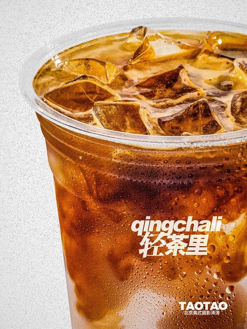The image presents a photorealistic, close-up shot of a clear plastic cup filled with a dark amber iced beverage, likely coffee or tea, featuring a highly detailed rendering style. The color palette is dominated by rich, warm amber and deep brown tones of the liquid, contrasted with the bright, cool transparency of the ice cubes and the stark white background. Lighting is bright, directional, and slightly harsh, creating sharp specular highlights on the wet plastic surface, the condensation droplets, and the facets of the ice, conveying a refreshing, cold temperature. Texture is emphasized through the hyper-realistic rendering of condensation beading on the cup's exterior, the porous, bubbly surface of the liquid, and the crisp, fractured edges of the ice cubes. The composition is a tight, slightly angled close-up that crops the top and bottom of the cup, focusing attention on the interplay of liquid, ice, and condensation, with a shallow depth of field that keeps the front surface sharp. Shape language combines the organic, irregular forms of the ice cubes and bubbles with the rigid, geometric curve of the cup's rim. The overall mood is crisp, refreshing, and appetizing, with a high-energy, commercial aesthetic designed to evoke a thirst-quenching sensation.