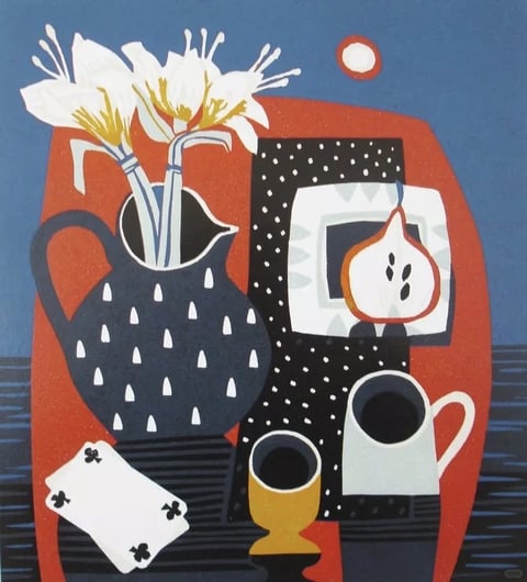 This still life painting features a flat, illustrative aesthetic with a bold, graphic quality, reminiscent of mid-century modern design. The color language is defined by a high-contrast palette of deep navy blue, vibrant terracotta red, and crisp white, with accents of mustard yellow and black, all rendered in solid, unmodulated blocks of color with minimal shading. The lighting is flat and even, lacking directional shadows or highlights, contributing to a stylized, two-dimensional feel rather than realistic depth. Textures are implied through pattern rather than rendered surface detail; the dark blue pitcher has a pattern of white teardrop shapes, the black cloth is dotted with white specks, and the table surface shows simple horizontal lines. Compositionally, the objects are arranged in a layered, overlapping manner against a large, simplified red shape that acts as a backdrop, creating a shallow, stage-like space. The shape language is a mix of stylized organic forms (the lily flowers, the fig) and clean geometric shapes (the rectangular cloth, the circular sun/moon), all defined by crisp, uniform edges and a lack of visible brushstrokes. The overall mood is playful, orderly, and visually striking, with a strong sense of decorative harmony and a calm, static energy.