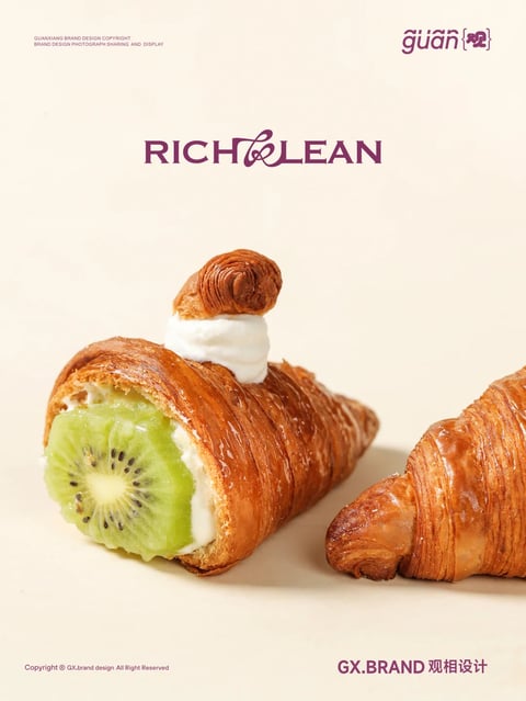 The image features a close-up, studio-style photograph of two golden-brown, flaky croissants against a soft, neutral beige background. One croissant is presented as a filled pastry, sliced open to reveal a vibrant green kiwi slice and a generous layer of white cream filling, with a small dollop of cream and a twisted pastry piece garnishing the top. The second croissant lies beside it, whole and uncut, showcasing its layered, buttery texture and glossy, caramelized crust. The overall composition is clean and minimalist, with elegant typography in a deep plum color reading 'RICH & LEAN' and brand logos in the corners, suggesting a sophisticated, high-end bakery or pastry brand aesthetic. The lighting is soft and directional, highlighting the intricate, flaky layers of the pastry and the fresh, juicy texture of the kiwi, creating an appetizing and luxurious visual appeal.