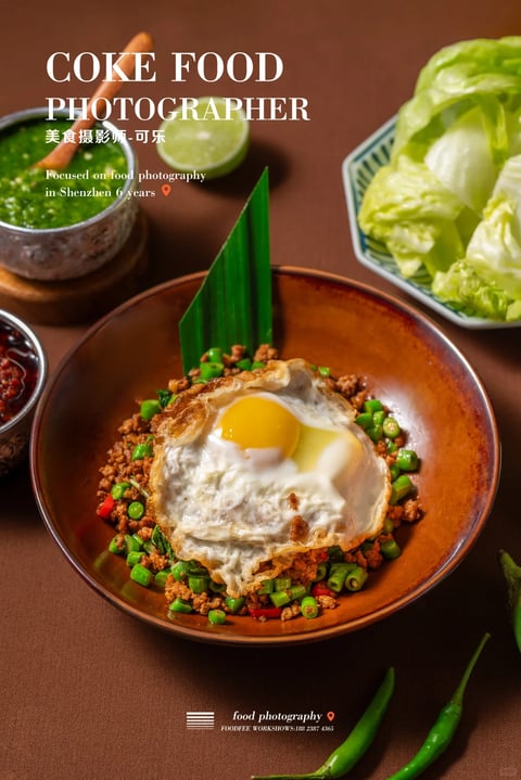 The image presents a photorealistic food photograph with a warm, inviting aesthetic. The dominant color palette is earthy and rich, featuring deep terracotta and brown tones in the bowl and background, contrasted by vibrant greens from the vegetables and a bright yellow egg yolk. The lighting is soft and directional, appearing to come from the upper left, casting gentle shadows that enhance the three-dimensional form of the dish and create a cozy, appetizing mood. Textures are rendered with high detail, from the crispy, lacy edges of the fried egg and the granular surface of the minced meat to the smooth, glossy yolk and the fresh, matte leaves of lettuce. The composition is a top-down, slightly angled shot that centers the main bowl, with supporting elements like a sauce dish, lime wedge, and lettuce arranged around it to create depth and a sense of a complete meal setting. The shapes are predominantly organic, with the round bowl and irregular food forms contrasted by the sharp, geometric lines of the text overlay and the structured arrangement of the side dishes. The overall atmosphere is warm, hearty, and professionally styled, evoking a sense of comforting, flavorful cuisine.