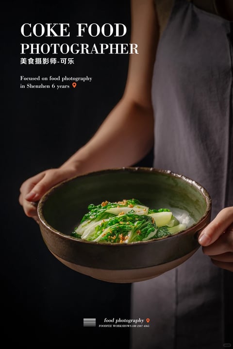 This image exhibits a photorealistic, professional food photography style with a strong emphasis on tactile realism and moody atmosphere. The color language is dominated by deep, muted tones: a near-black background contrasts with the earthy, dark brown ceramic bowl and the vibrant, fresh greens of the bok choy, which are accented by golden-brown fried garlic. The lighting is directional and dramatic, appearing to come from the upper left, casting soft yet defined shadows that sculpt the form of the bowl and the hands, creating a high-contrast, chiaroscuro effect that feels intimate and focused. The texture and material rendering are highly detailed, highlighting the glossy sheen of the sauce on the vegetables, the rough, matte exterior and glazed interior of the handmade ceramic bowl, and the soft, natural skin texture of the hands. The composition is centered and intimate, with a shallow depth of field that keeps the bowl and hands in sharp focus while the background and the person's torso recede into soft blur. Shape language is organic, defined by the curved rim of the bowl, the natural forms of the vegetables, and the gentle contours of the hands and arms. The overall mood is calm, sophisticated, and appetizing, conveying a sense of artisanal quality and quiet appreciation for the food.