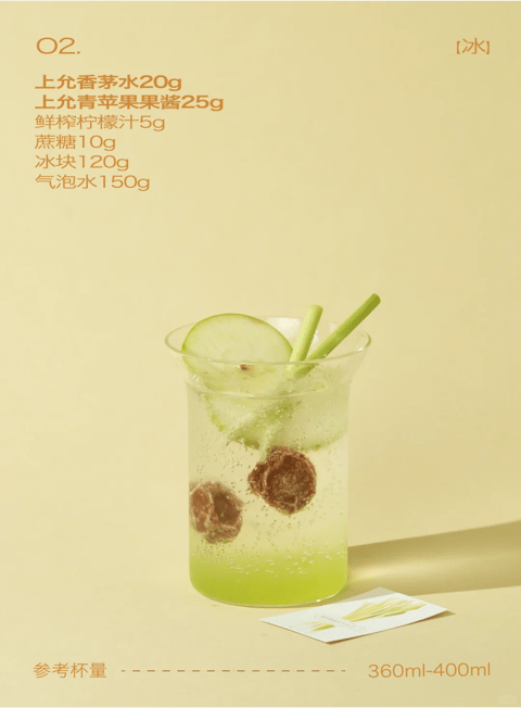 This image presents a photorealistic, studio-style product photograph of a refreshing green beverage, rendered with high clarity and a clean, minimalist aesthetic. The dominant color palette is a soft, desaturated pastel yellow-green, creating a monochromatic and cohesive look with low contrast and a warm, inviting color temperature. Lighting is soft and diffused, appearing to come from the upper left, casting gentle, elongated shadows to the right and highlighting the condensation on the glass and the effervescence within the liquid, conveying a cool, crisp mood. Textures are rendered with tactile precision: the smooth, transparent glass, the wet, icy surface of the drink, the porous, fibrous texture of the lemongrass stalks, and the slightly rough, matte finish of the background surface. The composition is centered and balanced, with the glass positioned slightly off-center to the left, framed against a seamless, solid-colored backdrop that creates a shallow depth of field, focusing all attention on the beverage. Shape language combines the organic, cylindrical form of the glass with the natural, irregular shapes of the ice cubes, cucumber slice, and lemongrass stalks, all defined by clean, sharp edges. The overall mood is serene, fresh, and appetizing, with a light visual weight that emphasizes clarity and simplicity.