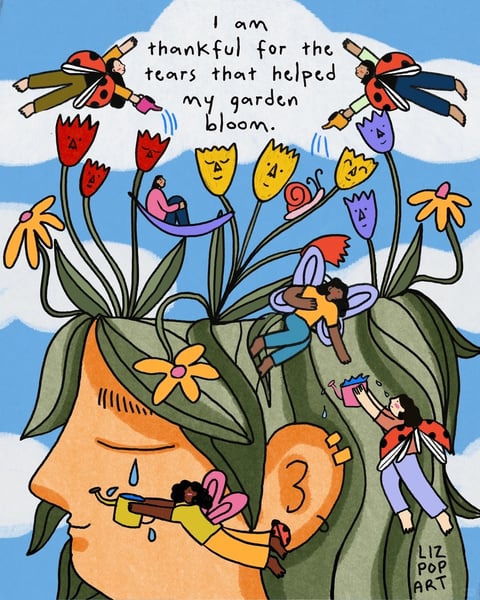 The image is a whimsical, illustrative artwork depicting a close-up profile of a person's head, where their hair transforms into a lush, green garden. The garden features tall, stylized flowers with simple, expressive faces in red, yellow, and purple, along with green leaves and stems. Tiny, fairy-like figures with ladybug wings are actively tending to the garden: one catches a tear from the person's eye in a yellow cup, another waters flowers with a pink watering can, a third rests in a purple hammock strung between stems, a fourth sits on a leaf, and two more fly above, sprinkling water from small containers. The person's face is rendered in a warm peach tone with closed eyes and a single tear, conveying a serene, contemplative expression. Visible text in the upper portion reads, 'I am thankful for the tears that helped my garden bloom,' in a handwritten, black script against a light blue sky with soft white clouds, reinforcing the theme of growth from sorrow. The visual aesthetic is flat and illustrative with bold, black outlines and a hand-drawn quality. The color language is vibrant and saturated, dominated by warm peach and green tones, accented with bright reds, yellows, and purples, creating a cheerful yet poignant contrast. Lighting is soft and even, with no harsh shadows, suggesting a gentle, diffused daylight. Texture and material feel are smooth and graphic, with no realistic surface details, emphasizing a playful, storybook quality. Compositionally, the image is tightly framed on the head and garden, with a shallow depth of field that keeps all elements in clear focus, arranged in a dynamic, vertical flow from the tear at the bottom to the flying figures at the top. Shape language is organic and curvilinear, with flowing lines for hair, leaves, and figures, using consistent, medium-weight outlines. The mood is introspective and hopeful, blending a sense of gentle melancholy with nurturing care and growth, creating an atmosphere of emotional resilience and beauty.