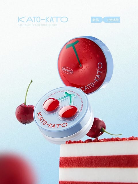 The image features a vibrant, photorealistic 3D-rendered scene centered on two cosmetic powder compacts from the brand KATO-KATO, floating dynamically above a slice of red velvet cake against a soft, gradient blue background. The composition is playful and asymmetrical, with the compacts positioned at different angles—one upright and one tilted—to create a sense of movement and depth, accompanied by two glossy, dewy cherries that enhance the fresh, fruity theme. Visible text includes the brand name 'KATO-KATO' in a clean, sans-serif font on both compacts, the word 'REFRESH' in a small oval on the red compact, and the product descriptor 'CLOUDY TO MIST MINERAL LOOSE SETTING POWDER' in a circular arrangement around the cherry design on the white compact, all in English script that reinforces the product's identity and function. The visual aesthetic is polished and commercial, with a focus on hyper-realistic rendering that emphasizes tactile qualities; the color language is dominated by high-saturation reds and crisp whites against a cool, light blue backdrop, creating a high-contrast, refreshing palette with warm highlights on the cherries and compacts. Lighting is soft and directional, coming from the upper left, casting gentle shadows and creating glossy reflections on the wet surfaces of the cherries and the compact lids, which conveys a clean, inviting mood. Texture and material feel are meticulously detailed, with the compacts showing smooth, plastic surfaces, the cherries exhibiting a juicy, dewy skin with water droplets, and the cake slice displaying a crumbly, layered texture, all rendered with a tactile, almost tangible quality. The shape language combines organic forms (the cherries, the curved compact lids) with geometric precision (the circular compacts, the rectangular cake slice), using smooth edges and balanced proportions. The overall mood is energetic, playful, and refreshing, evoking a sense of youthful vibrancy and indulgent freshness through its bright colors, dynamic arrangement, and appetizing visual cues.