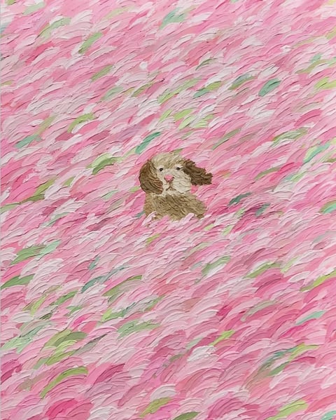 The image is a painterly, textured illustration of a small, fluffy brown and white dog, likely a Cavalier King Charles Spaniel, peeking out from a dense, swirling field of pink and white brushstrokes that suggest a sea of flowers or petals. The composition centers the dog within this dynamic, almost abstract background, which fills the entire frame with rhythmic, diagonal strokes of thick impasto paint. There is no visible text in the image. The visual aesthetic is highly textured and tactile, with visible, raised brushstrokes creating a sense of movement and depth; the rendering is painterly rather than photorealistic, emphasizing the materiality of the paint. The color language is dominated by a soft, saturated palette of various pinks—from pale blush to deeper rose—interspersed with white and subtle hints of green, creating a warm, gentle, and dreamy atmosphere. The lighting appears soft and diffused, with no harsh shadows, contributing to the gentle mood. The texture is pronounced, with the thick, layered paint creating a physical, almost three-dimensional surface quality. The composition uses a central focal point (the dog) surrounded by a swirling, patterned background that creates a sense of enclosure and whimsy. The shape language is organic, with soft, curving lines in both the dog's fur and the floral strokes, and edges are blended rather than sharp. The overall mood is sweet, peaceful, and slightly fantastical, with a low-energy, calming visual weight.