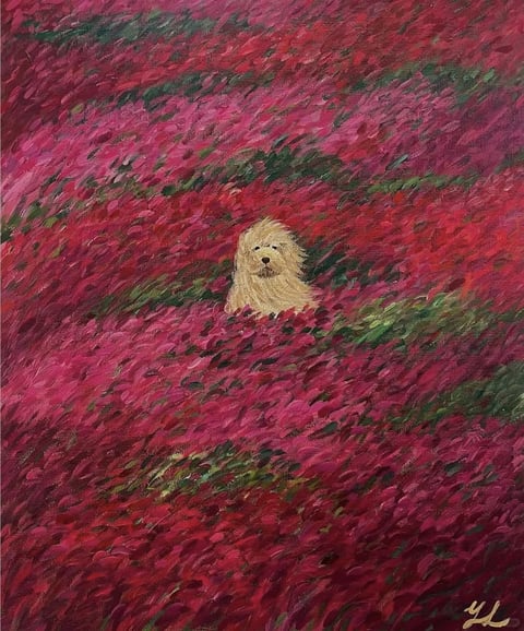 This image is a painterly, impressionistic oil painting depicting a small, fluffy, cream-colored dog (likely a Maltese or similar breed) partially submerged in a vast, dense field of vibrant magenta and deep red flowers. The composition places the dog centrally within the frame, surrounded by a swirling, textured sea of petals that dominate the visual space, creating a strong sense of immersion and scale where the animal appears small against the overwhelming floral backdrop. The visual aesthetic is characterized by thick, expressive impasto brushstrokes that give the flowers a rich, tactile, almost three-dimensional texture, with the paint applied in short, directional dabs that suggest movement and organic form. The color language is dominated by a highly saturated palette of cool-toned magentas, crimsons, and deep pinks, contrasted with the warm, soft cream of the dog's fur and interspersed with dark green foliage strokes that add depth and shadow. Lighting appears soft and diffused, with no harsh shadows, creating an even, gentle illumination that enhances the dreamy, ethereal quality of the scene. The composition uses a shallow depth of field effect, with the foreground and background flowers blending into a continuous, textured pattern, focusing visual attention on the dog's face and upper body. The shape language is entirely organic, with soft, rounded forms for the dog and irregular, petal-like shapes for the flowers, all rendered with soft edges that blend into one another. The mood is serene, whimsical, and slightly melancholic, evoking a sense of peaceful solitude and natural beauty. There is no obvious readable text within the main image content, though a small, stylized signature in gold paint appears in the bottom right corner.