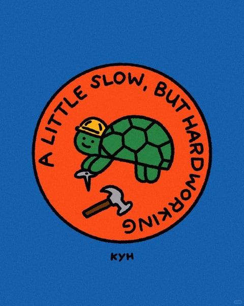 The image features a central, circular orange emblem set against a solid, vibrant blue background. The emblem contains a cartoon-style green turtle wearing a yellow construction hard hat, positioned above a hammer and a nail, suggesting a construction or work theme. The turtle is depicted with a simple, friendly expression, a rounded shell with hexagonal patterns, and a smooth, flat rendering style. The text "A LITTLE SLOW, BUT HARDWORKING" curves along the upper and right edges of the orange circle in a bold, black, sans-serif font, with the word "HARDWORKING" appearing inverted along the bottom curve. The overall aesthetic is illustrative and flat, with clean black outlines defining all shapes, including the turtle, tools, and text. The color palette is limited and highly saturated, dominated by the bright orange of the emblem, the vivid blue background, the green of the turtle, and the yellow of the hard hat, creating strong, high-contrast visual elements. The lighting is flat and uniform, with no shadows or gradients, emphasizing the graphic, sticker-like quality. The composition is centered and symmetrical, with the circular emblem acting as a clear focal point, framed by the expansive blue negative space. The shape language combines the organic, rounded forms of the turtle with the geometric precision of the circular border and the angular tools. The mood is cheerful, motivational, and playful, conveyed through the cute character design, bright colors, and positive text.