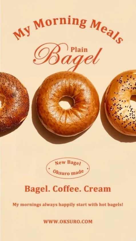This is a vertically oriented promotional poster with a warm, beige background featuring a minimalist composition of three bagels arranged horizontally across the center. The left bagel has a dark, coarse, possibly everything or cinnamon-raisin coating with a glossy sheen; the center bagel is a smooth, plain, golden-brown variety with a prominent central hole and a toasted, slightly wrinkled surface; the right bagel is topped with black sesame seeds and has a light, golden-brown crust. The image uses a flat, illustrative rendering style with subtle photorealistic textures on the bagels, employing a warm, monochromatic color palette dominated by shades of beige, caramel, and dark brown, with high contrast between the bagels and the background. The lighting is soft and directional from the upper left, casting gentle, diffused shadows beneath each bagel to create a sense of shallow depth and a warm, inviting mood. Text appears in a stylized, serif typeface in a deep burnt orange color. At the top, arched text reads 'My Morning Meals'. Below this, in a larger, cursive script, 'Plain' precedes 'Bagel'. In the lower third, an oval stamp-like graphic contains the text 'New Bagel' above 'Oksuro made'. Below this, a line of text reads 'Bagel. Coffee. Cream', followed by a smaller sentence: 'My mornings always happily start with hot bagels!'. At the very bottom, the URL 'WWW.OKSURO.COM' is displayed. The composition is balanced and symmetrical, with the bagels as the clear focal point, creating a clean, appetizing, and cheerful visual atmosphere that emphasizes a simple, comforting morning routine.