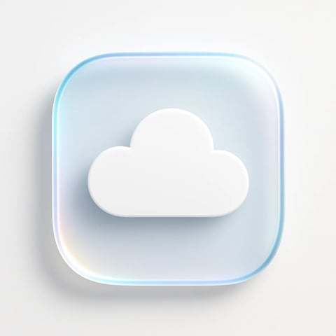 This image presents a 3D, semi-transparent, rounded square icon centered on a plain white background, featuring a raised, solid white cloud shape at its core. The icon is rendered with a photorealistic, glossy finish, mimicking the look of polished glass or high-quality plastic, with a subtle inner glow and a soft, iridescent edge that transitions from light blue to pale pink and yellow hues along its left curve. The composition is centered and symmetrical, with a shallow depth of field emphasized by a soft shadow beneath the icon, grounding it visually. The lighting is soft and diffused, appearing to come from the upper left, creating gentle highlights on the raised cloud surface and a subtle gradient across the translucent square background. The color palette is minimalist and cool, dominated by clean whites, soft blues, and faint pastel accents, conveying a clean, modern, and serene digital aesthetic. There is no visible text in the image.