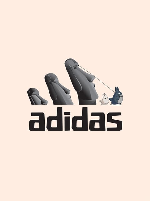The image features a creative, illustrative redesign of the Adidas logo, merging the brand's iconic three-stripe mountain motif with characters from Studio Ghibli's "My Neighbor Totoro." The composition is centered on a soft, pale peach background, with three ascending, stylized forms that evoke both the Adidas logo's striped peaks and the silhouettes of large, hooded or stone-like figures. The largest form on the right is dark gray and black, with a thin black line extending from its top like a leash, connecting to a small, dark blue Totoro character standing to its right. Beside Totoro is a smaller, light gray soot sprite or similar creature. Below this graphic element, the word "adidas" is rendered in a bold, blocky, custom black typeface with squared-off letterforms and internal cutouts, positioned centrally. The visual aesthetic is flat and illustrative with subtle 3D shading on the logo forms to give them volume, using a muted palette of grays, black, and dark blue against the warm, low-saturation peach backdrop. Lighting is implied through soft gradients on the forms, suggesting a gentle, diffuse light source from the upper left. The texture is smooth and digital, with clean edges and a playful, whimsical mood created by the fusion of corporate branding and beloved animation characters.