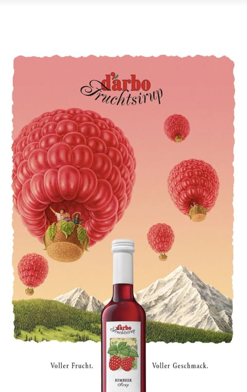 This image is a whimsical, illustrative advertisement for d'arbo Fruchtsirup (fruit syrup), centered around the theme of raspberries. The main subject is a large, vibrant red raspberry transformed into a hot air balloon, carrying a basket with illustrated figures. This central raspberry balloon is surrounded by smaller raspberry balloons floating in a gradient sky that shifts from a soft peach at the top to a warm amber near the horizon. Below, a scenic landscape features rolling green hills and snow-capped, sketched mountains. The composition uses a central, slightly low-angle perspective to emphasize the floating raspberry balloons against the expansive sky, creating a sense of playful depth. The visible text includes the brand name "d'arbo Fruchtsirup" in an elegant, cursive red font at the top center, and the product label on a photorealistic bottle in the foreground reads "d'arbo Fruchtsirup," "HIMBEER Sirup," and the taglines "Voller Frucht." (Full of fruit) and "Voller Geschmack." (Full of flavor) in a clean serif font at the bottom. The visual aesthetic is a charming blend of detailed, hand-drawn illustration for the balloons and landscape with a photorealistic product shot. The color language is dominated by a warm, saturated palette of raspberry reds, peachy pinks, earthy greens, and crisp whites, creating a cheerful and appetizing mood. Lighting is soft and diffused, suggesting a gentle, golden-hour glow that enhances the warm color temperature and gives the scene a dreamy quality. Textures are varied, with the raspberry balloons rendered to feel plump and juicy with visible drupelets, the basket woven, the mountains sketch-like with fine linework, and the syrup bottle glass smooth and reflective. The shape language is primarily organic, featuring the rounded, bumpy forms of the raspberries and rolling hills, contrasted by the sharp, geometric peaks of the mountains. The overall mood is fantastical, joyful, and inviting, evoking a sense of natural abundance and flavorful adventure.