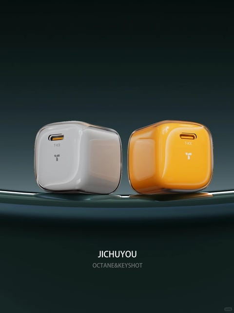 The image presents a highly photorealistic, 3D-rendered scene featuring two compact, cube-shaped electronic chargers as the central subjects, positioned side-by-side on a sleek, dark reflective surface against a smooth, deep teal gradient background. The composition is clean and centered, with the two objects occupying the middle ground, creating a sense of balanced symmetry. The charger on the left is rendered in a matte, cool off-white or light gray finish, while the one on the right is a vibrant, saturated orange. Both share identical rounded-square forms with soft, organic edges and a glossy, translucent outer casing that encases the solid-colored core, giving a layered, premium material feel. Each charger has a single USB-C port visible on its front face, with the port's interior detail rendered in a contrasting orange tone. Below the port, subtle branding text is printed: "T-ICE" in a small, sans-serif font, and beneath that, a minimalist "T" logo. At the bottom of the entire image, centered text reads "JICHUYOU" in a bold, white sans-serif font, with "OCTANE&KEYSHOT" in a smaller, lighter gray font beneath it, indicating the rendering software used. The lighting is soft and directional, coming from the upper left, casting gentle, diffused highlights on the glossy surfaces and creating soft, warm reflections on the orange charger and cool, subtle shadows on the white one, which enhances their three-dimensional form and material contrast. The overall mood is minimalist, modern, and tech-focused, emphasizing clean design, material quality, and a sophisticated, high-end aesthetic through its controlled color palette, precise rendering, and ample negative space.