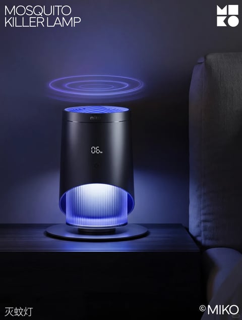 This is a photorealistic product advertisement image centered on a sleek, cylindrical mosquito killer lamp placed on a dark wooden nightstand beside a textured gray fabric bed headboard. The lamp, rendered in matte black metal with a subtle sheen, features a glowing blue light emanating from its ribbed lower section and a top vent emitting concentric blue wave-like graphics, suggesting ultrasonic or light-based mosquito attraction. The scene is set in a dimly lit, dark blue-toned bedroom environment with a shallow depth of field, emphasizing the lamp as the focal point. Visible text includes 'MOSQUITO KILLER LAMP' in large, clean white sans-serif font at the top left, 'MIKO' in smaller white text on the lamp's upper rim, a digital display showing '06' on the lamp's front, a faint power icon below the display, Chinese characters '灭蚊灯' (mosquito lamp) at the bottom left, and a copyright symbol with 'MIKO' at the bottom right. The lighting is moody and directional, with soft blue ambient glow from the lamp casting subtle highlights on the nightstand and headboard, creating high contrast against the deep shadows. The texture of the matte metal lamp contrasts with the smooth wooden surface and woven fabric. The composition uses a central, eye-level framing with a balanced, minimalist arrangement, while the shape language is predominantly geometric with the cylindrical lamp and circular base. The overall mood is calm, modern, and technologically sophisticated, with a cool color temperature dominated by deep blues, blacks, and accents of white light.