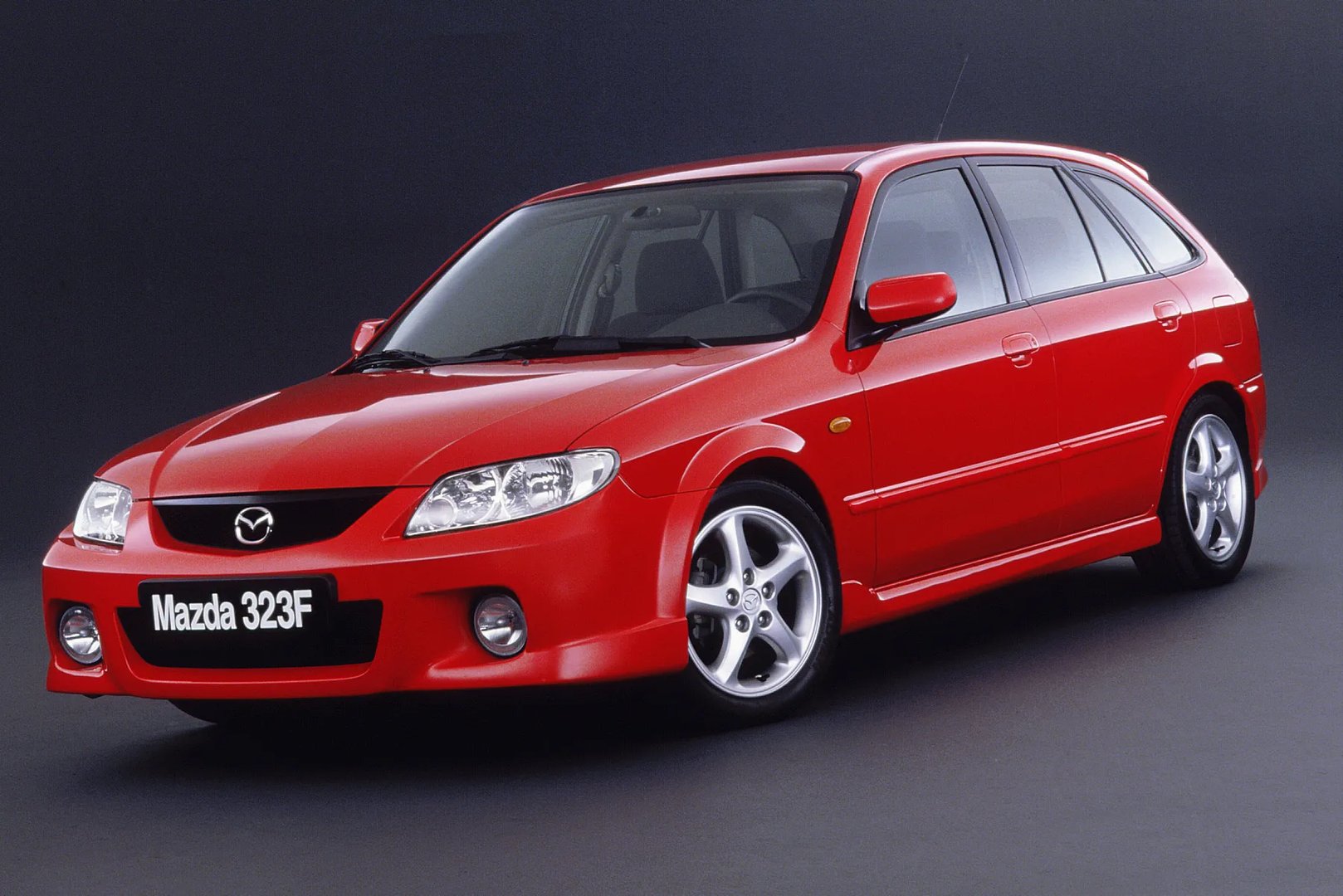 Mazda 323 Lantis 6 generation, restyling  Hatchback 5-door