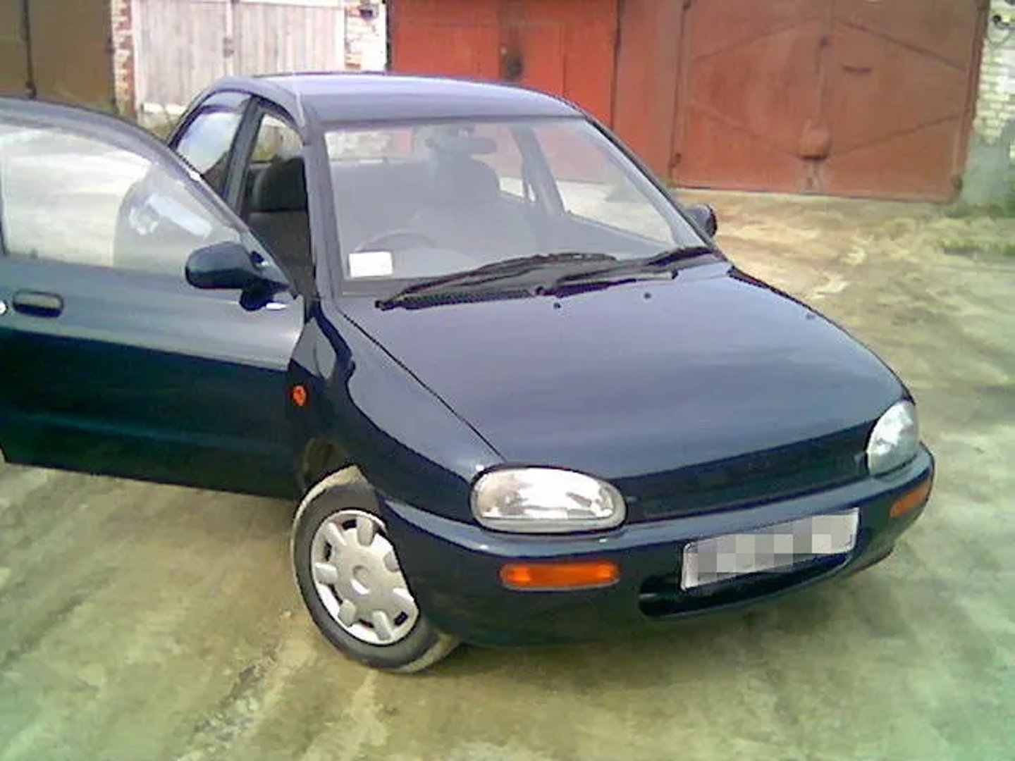 Mazda_Revue_1_generation__Sedan__2.jpg
