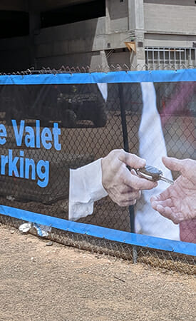 close up fence mesh banner material installed at construction site