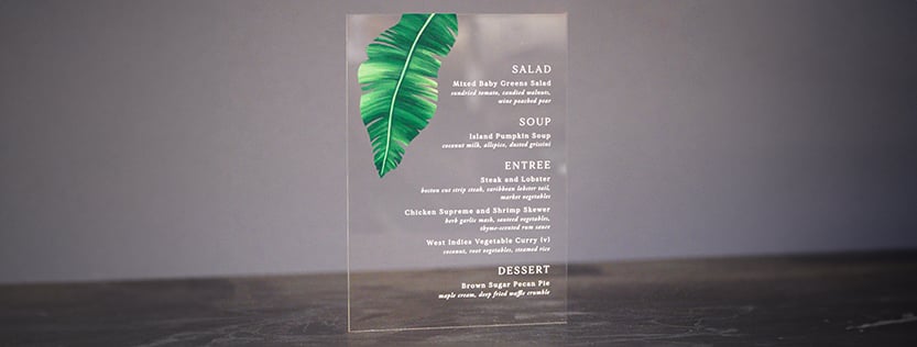 Clear acrylic menu printed using white ink and color.
