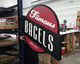Newly printed signage for Famous Bagels