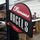 Newly printed signage for Famous Bagels