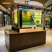 Printed signage for a mall kiosk.