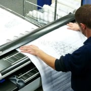 Man operating document scanning equipment