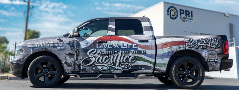 Full truck wrap with a design dedicated to military service members.