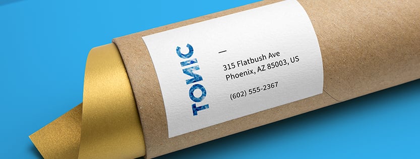 Shipping label pasted to a cardboard tube package for the company Tonic.