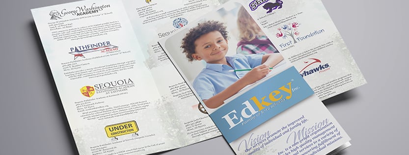 A school tri-fold brochure for Edkey Inc. featuring a young smiling boy on the cover.