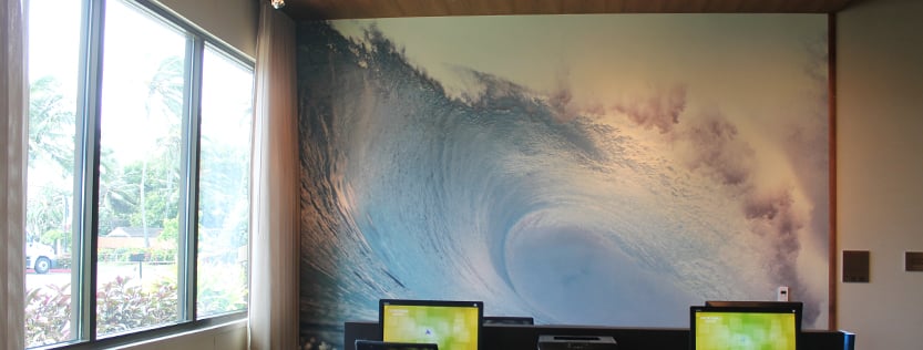 Commercial printed vinyl wallcovering featuring a photograph of a large wave.