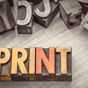 Stylized graphic showing the word PRINT using printer blocks.