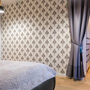 Large printed wall covering in a bedroom