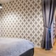 Large printed wall covering in a bedroom