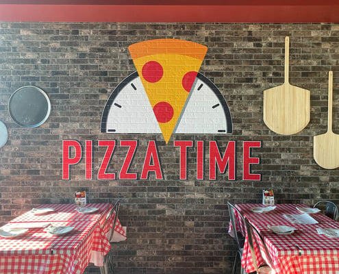 Printed wall graphics for Pizza Time at the Odysea Aquarium.